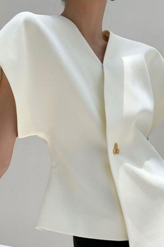 Marise | Top skulpturel silhuet med guldspænde